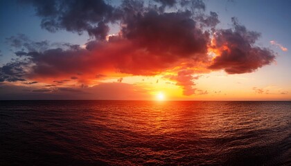 Canvas Print - dramatic natural sky round sun on the sea red clouds sunset scenery panorama