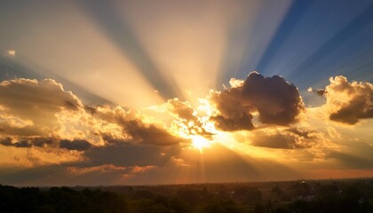 Wall Mural - bright sunlight with golden rays bright sunlight shining through the clouds creating golden rays and a warm radiant atmosphere