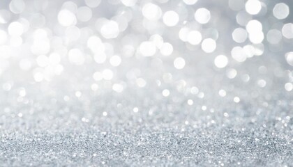 defocused monochromatic light background with an abstract silver glitter backdrop perfect for a copy space image