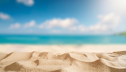 sand close up with blurred background of the sea and sky on a sunny day ideal for product presentation