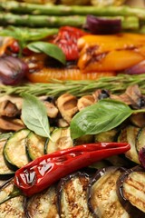 Wall Mural - Delicious grilled vegetables with spices on table, closeup