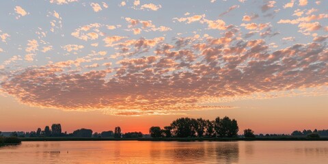 Poster - Dusk sky with cirrocumulus clouds in a serene setting with an orange hue