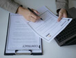© Ople - Business woman employer holds resume and talks with job applicant for job interview about her career and personal history in company, recruitment concept