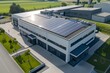 © kinara art design - An aerial view of a modern industrial building with solar panels on the roof.