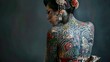 © kinara art design - A young woman with elaborate Japanese tattoos on her back and face, wearing a traditional kimono, poses against a dark background.
