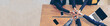 © aFotostock - Banner Partners hands together teamwork group of business people meeting in firm company office. Panorama Diversity Hands join empower partner teams connection Mergers acquisitions social community