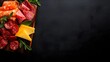 © Paul - Charcuterie board from above, a mix of cured meats and cheeses with sprigs of herbs, set on a black surface, high-contrast lighting, plenty of negative space.
