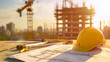 © Mutshino_Artwork - Construction site with blueprints and safety helmet at sunrise