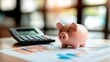 © keks20034 - A pink piggy bank on the background of financial charts and a calculator symbolizes financial management