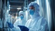 © Charoen - Chemical plant workers in protective gear inspecting equipment, focusing on safety and quality assurance.