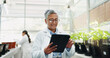 © PeakPoints/peopleimages.com - Happy, woman and science with tablet in greenhouse for biochemistry, research and ecosystem. Scientist, innovation and mature person with tech by plants for ecology, development and climate change