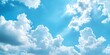 © Thanthara - Beauty of summer sky with scattering of fluffy white clouds against backdrop of bright blue. Scene exudes tranquility and making ideal for aim to evoke calm and peaceful atmosphere