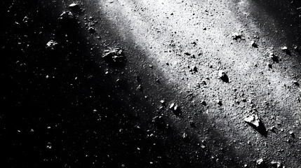 A black and white depiction of asteroids in space.
