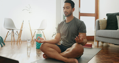 Canvas Print - Laptop, pilates and man with meditation in house living room for yoga training, online class or breathing. Lotus, zen person and calm yogi relax for mental health, chakra balance or internet guide