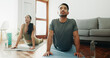 © peopleimages.com - Yoga, couple and stretching in home for calm, wellness and spiritual healing. Man, woman and cobra pose in pilates for healthy body, activity in relationship and positive mental health in living room