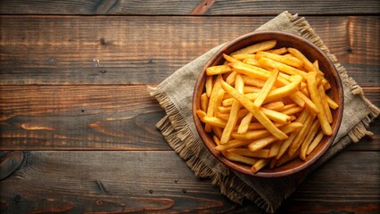 Wall Mural - Top view of a pile of crispy golden French fries on a rustic background, French fries, potatoes, fast food, snack, fried