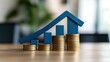 © pornsawan - Red Upward arrow on money coin stack as growth graph steps in home shape symbol,Savings, income, home investment, real estate price value, property profit concepts,the rising price of real estate.