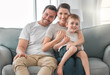© DavisShared/peopleimages.com - Couch, parents and boy in portrait for love, connection and bonding together in family home. House, mother and father with child for security, hugging and embrace relationship with smile in sofa