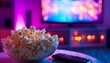 © TigerDude - A bowl of popcorn and remote control on the table against a background with a TV screen, showing a living room interior