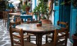 © Habibah - Chairs with tables in typical Greek tavern in Little Venice part of Mykonos town, Mykonos island, Greece.