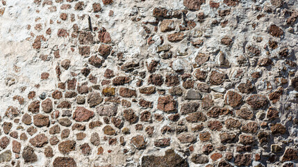 Wall Mural - Texture of an old antique stone wall. Background for design.