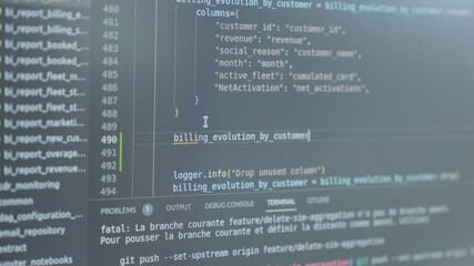 Wall Mural - close-up shot of lines of code being typed in by a software engineer