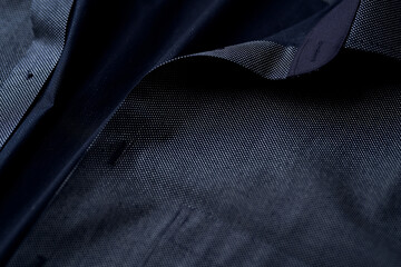 Wall Mural - Close up of dark Men's shirt. Soft focus. Copy space.	