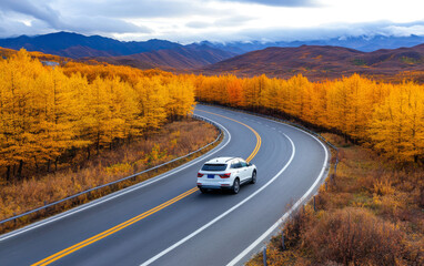 A white SUV car driving on the highway road