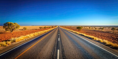 Endless Australian roads disappearing into the horizon under a clear blue sky , Australia, outback, road trip, driving