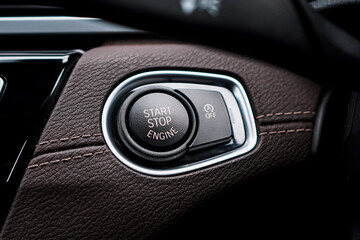 Close up engine car start button. Start stop engine modern new car button,Makes it easy to turn your auto mobile on and off. a key fob unique ,selective focus	
