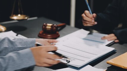 Wall Mural - Business and lawyers discussing contract papers with brass scale on desk in office. Law, legal services, advice, justice and law concept picture with film grain effect