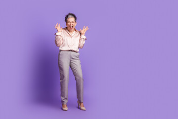 Sticker - Full body photo of attractive retired woman scared raise hands scream dressed stylish satin clothes isolated on violet color background