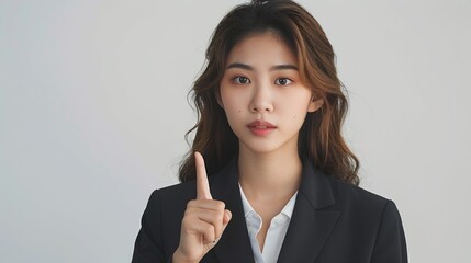 Wall Mural - Beautiful young Asian business woman in casual suit pointing finger isolated on white background : Generative AI