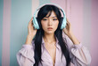 © PTD - A cute young Asian woman with long hair, wearing pastel headphones on a pastel wall background