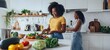 © Sagar - Bustling kitchen scene featuring two women engrossed in food prep