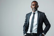 © Vovmar - Portrait of smart successful African American man in business suit on white background. Generated by artificial intelligence