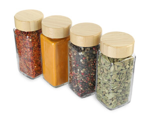 Wall Mural - Different spices in glass jars isolated on white