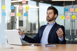 © Liubomir - Businessman practicing meditation at desk surrounded by sticky notes and laptop. Focus on stress relief, mindfulness, and mental clarity in busy office environment. Relaxation techniques in workplace