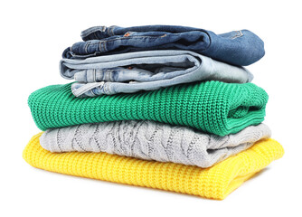 Canvas Print - Stack of sweaters and jeans isolated on white