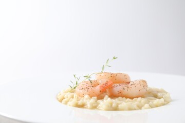 Wall Mural - Delicious risotto with shrimps and cheese on plate, closeup