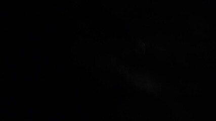 Wall Mural - Fast motion of first quarter moon or waxing gibbous moving among mysterious clouds at night. Telephoto view, real midnight footage with black background. Creepy halloween sky, astrology concept.