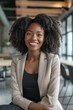 © Andrii Zastrozhnov - Positive and successful businesswoman in an elegant suit, smiling cheerfully in an office portrait, exuding confidence and professionalism.
