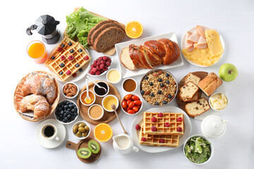 Wall Mural - Different meals served for breakfast on white table, flat lay