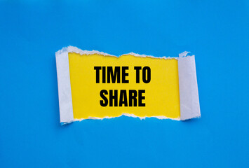 Time to share message written on ripped torn blue paper with yellow background. Conceptual time to share symbol. Copy space.