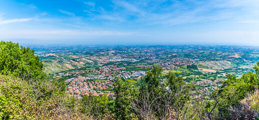 Wall Mural - A panorama view down from the base of the first tower in the fortified section of San Marino, Italy in summertime