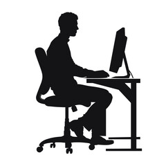 Wall Mural - Silhouette of a man working on a desktop computer, seated on an ergonomic chair.