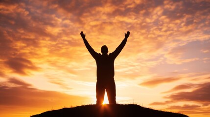 Poster - Silhouette of a person with raised arms, worshiping at sunrise on a hilltop, with a radiant sky in the background 