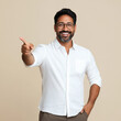 © Niks Ads - happy indian founder in a formal shirt pointing down