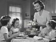 © Hanna - Vintage 1950s Family Dinner with Mother Serving Roasted Chicken