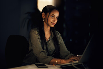Poster - Woman, typing and laptop at night for business with smile for research, email or report. Journalist, blog and technology for article, review and social media for online magazine or website in office